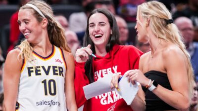 Indiana Fever guard Caitlin Clark talks to teammates during the third quarter against the Golden State Valkyries