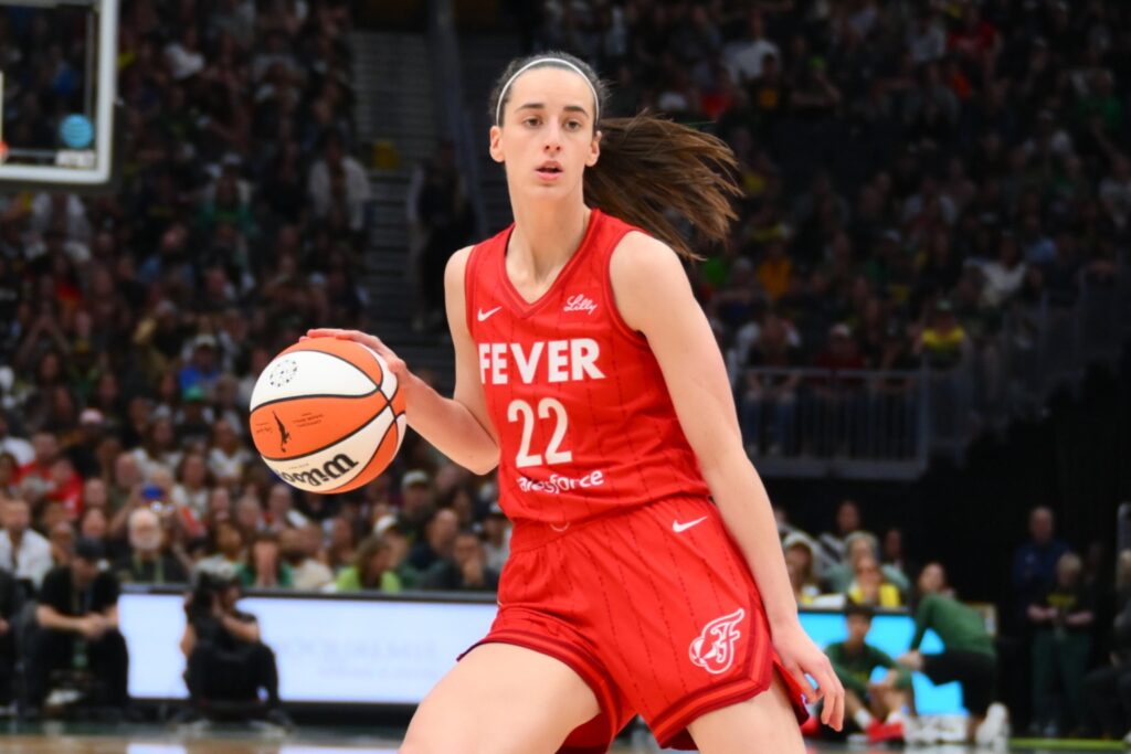 Indiana Fever guard Caitlin Clark dribbles the ball against the Seattle Storm