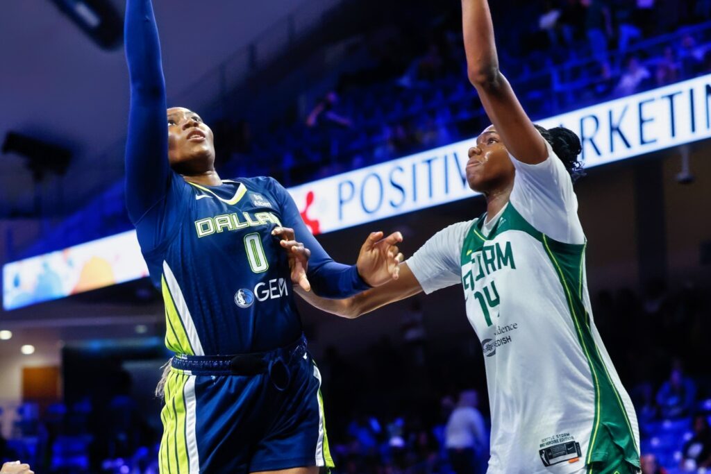 Amy Okonkwo Scores a Basket Against Seattle Storm Center Dominique Malonga