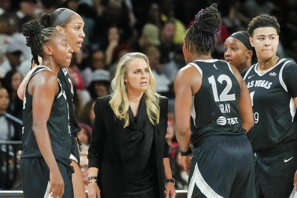 Las Vegas Aces head coach Becky Hammon with Las Vegas Aces Team
