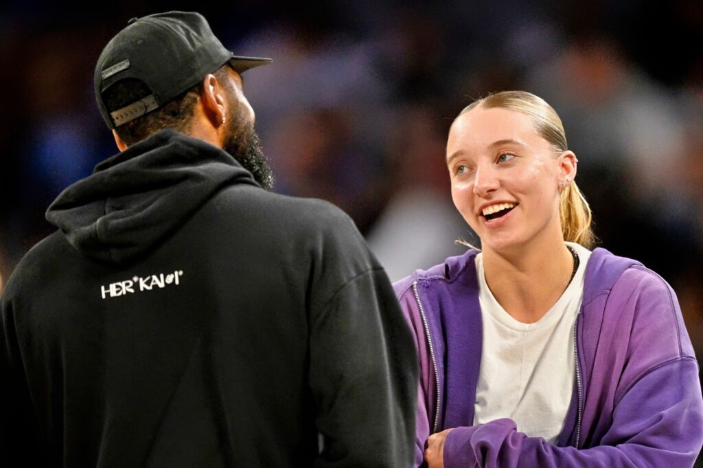 Dallas Mavericks Guard Kyrie Irving Talks with Dallas Wings Guard Paige Bueckers
