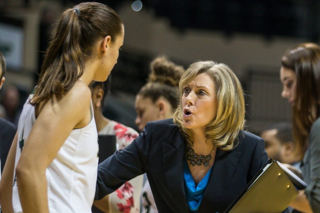 Michele Woods-Baxter and a USF player