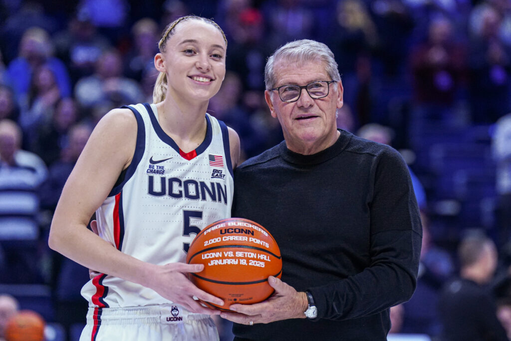 Paige Bueckers and Geno Auriemma